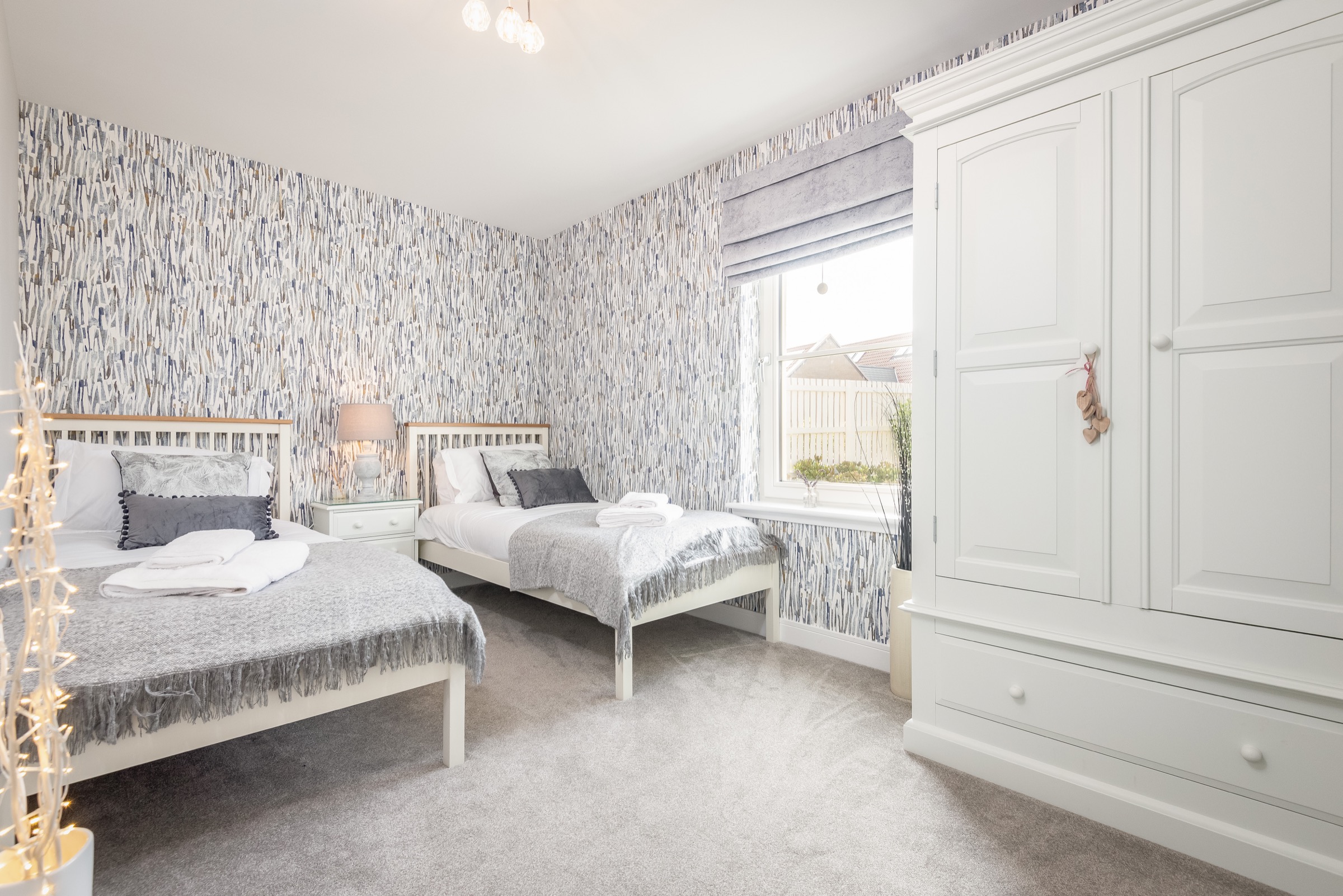 Bedroom at Dormie House with a double bed and a single bed
